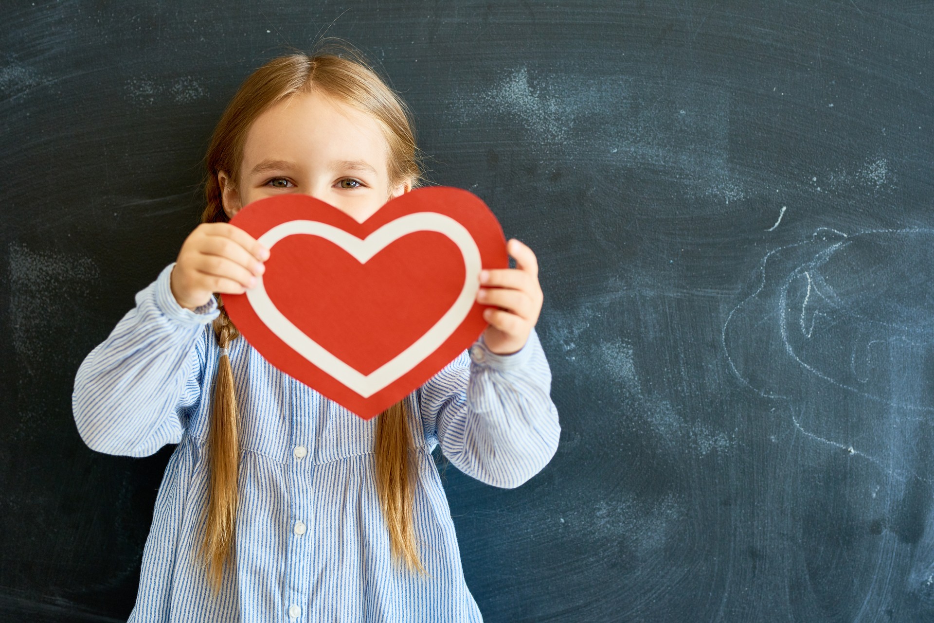 Cute Little Girl Holding Paper Heart